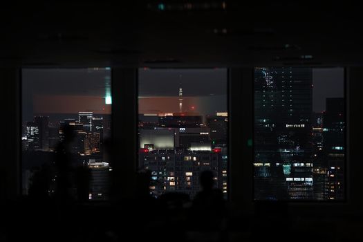 Silhouette of urban night view and people. Shooting Location: Tokyo metropolitan area