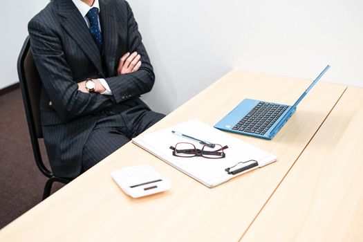 Businessman doing desk work. Shooting Location: Yokohama-city kanagawa prefecture