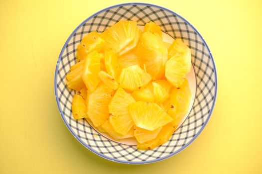 slice of pineapple in bowl on table .