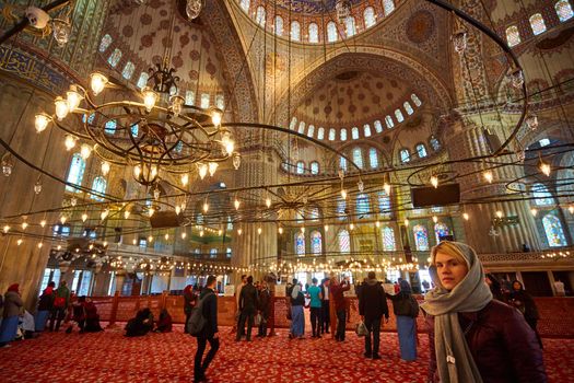 Istanbul, Turkey - 1 April, 2017: Interior of blue Mosque also called Sultan Ahmed Mosque or Sultan Ahmet Mosque in Istanbul, Turkey.Ceiling decorations with Islamic elements of Sultan Ahmed Mosque dome