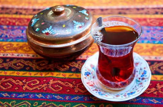 Thr black turkish tea in traditional glass.