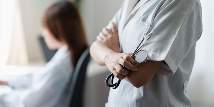 Young Doctor with stethoscope tools at clinic. Medicine and health care concept