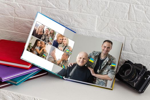 military family photo book with ukraine flag.