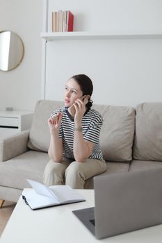 office manager or freelancer in a stylish room. Confident business woman working at workplace in a modern office. Office manager or freelancer work.