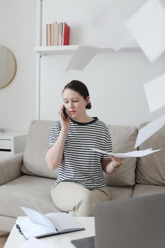 office manager or freelancer in a stylish room. Confident business woman working at workplace in a modern office. Office manager or freelancer work