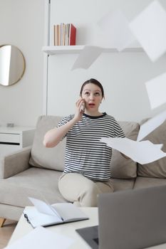 office manager or freelancer in a stylish room. Confident business woman working at workplace in a modern office. Office manager or freelancer work