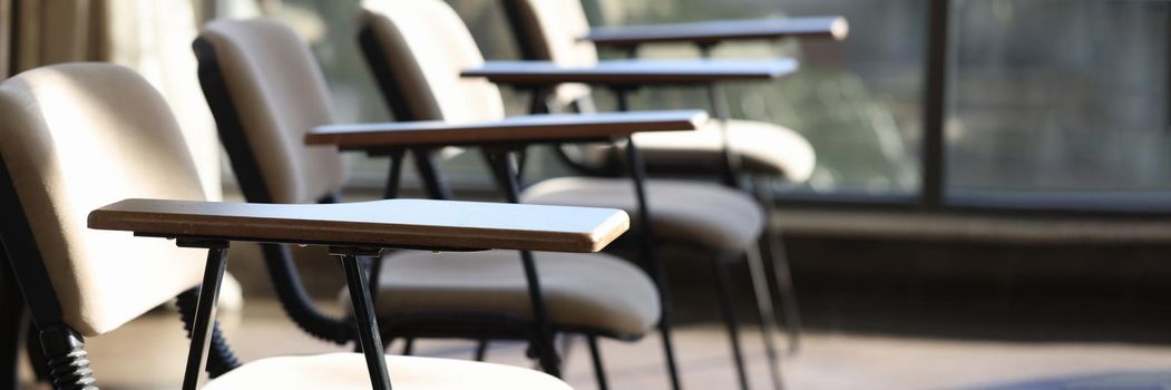 Empty chairs standing in conference room closeup. Rent of halls for lectures and seminars concept