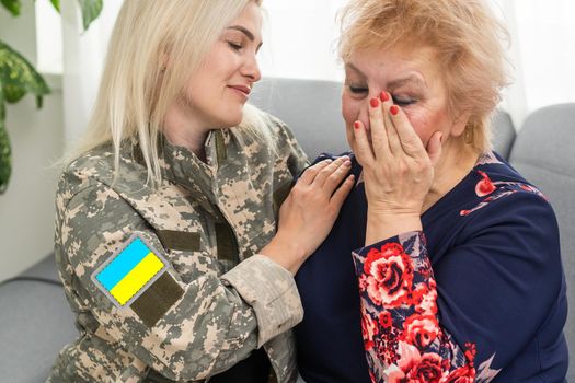 Soldier woman reunited with her mother.