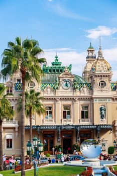 Monaco, Monte Carlo, 21 August 2017: Casino at sunset, mirror monument, a lot of tourist, architecture of principality. High quality photo