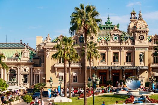 Monaco, Monte Carlo, 21 August 2017: Casino at sunset, mirror monument, a lot of tourist, architecture of principality. High quality photo