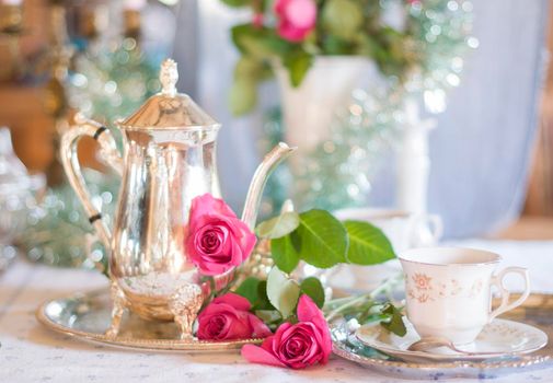 Tea break in English style, vintage silver service against the background of New Year's decor, festive still life, shallow depth of field, light and air