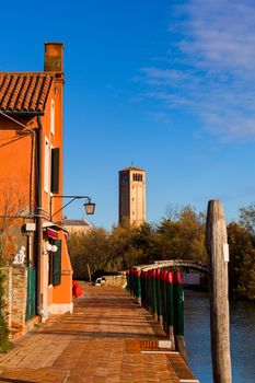 View of the Devil's Bridge and the bell tower on the island of Torcello, Venice. Italy