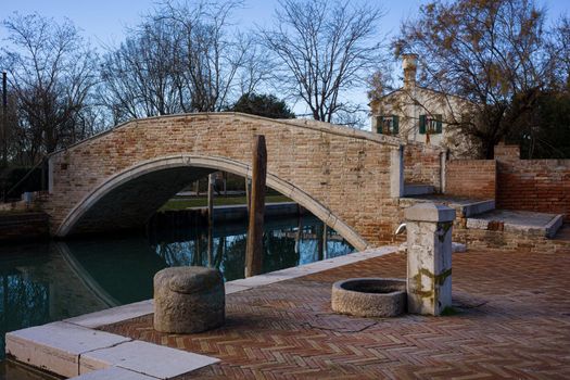 View of the bricks Bridge on the island of Torcello, Venice. Italy