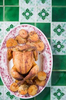 Christmas Chicken Baked with Potatoes and Cranberry Sauce, Christmas Dinner, Holiday Dinner, a step-by-step recipe for decorating a fried chicken, high quality photo