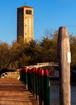 View of the Devil's Bridge and the bell tower on the island of Torcello, Venice. Italy