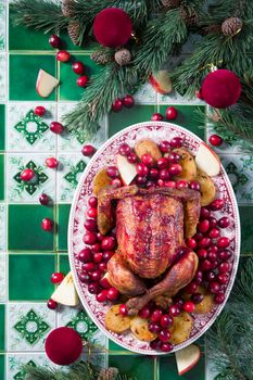 Christmas Chicken Baked with Potatoes and Cranberry Sauce, Christmas Dinner, Holiday Dinner, a step-by-step recipe for decorating a fried chicken, high quality photo