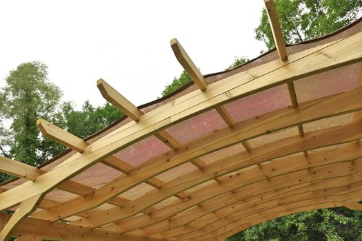 Underside of a Finely Crafted Pergola Roof with Burlap or Canvas Covering to Provide Shade. High quality photo