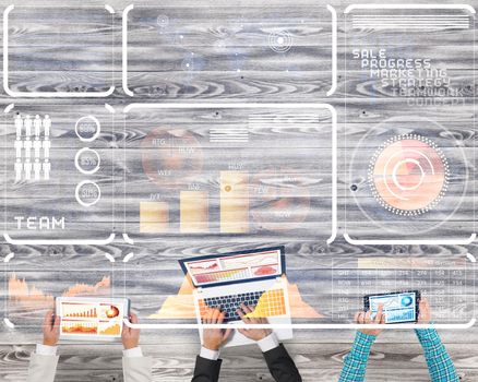 Group of three people with devices in hands working together as symbol of networking and communication