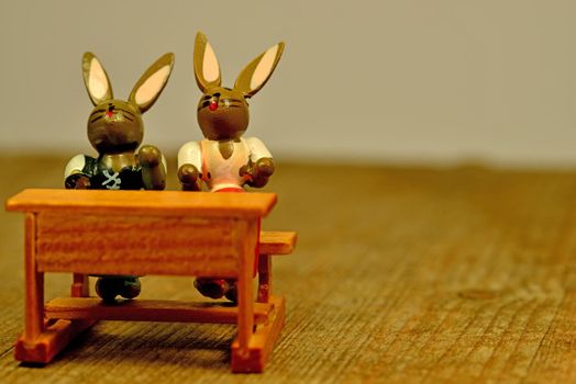 easter bunnies on the school bench
