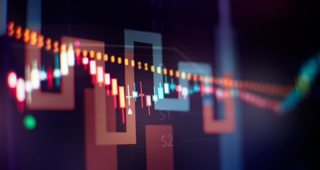 Abstract financial graph with candle stick and bar chart of stock market on financialbackground