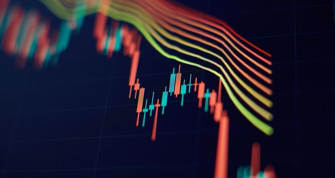 Concept of stock market and fintech. Blurry digital charts over dark blue background.