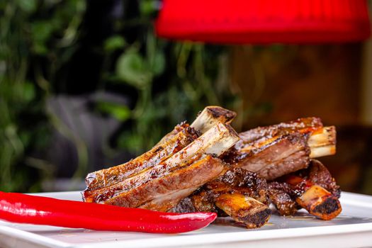 Baked beef ribs with spices are on the board