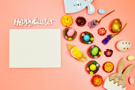Coloeful easter eggs in nest on pink color background with space. Minimal concept. Card with copy space for text.