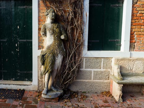 View of a woman Stone sculpture in Torcello island, Italy