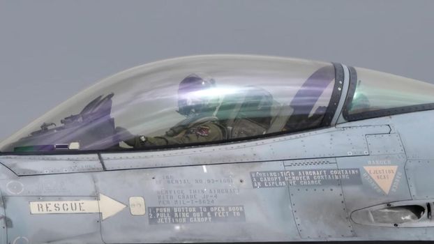 Andravida Greece APRIL, 1, 2022 Canopy of military plane with fighter jet pilot inside. Lockheed Martin F-16 Fighting Falcon of Greece Armed Forces