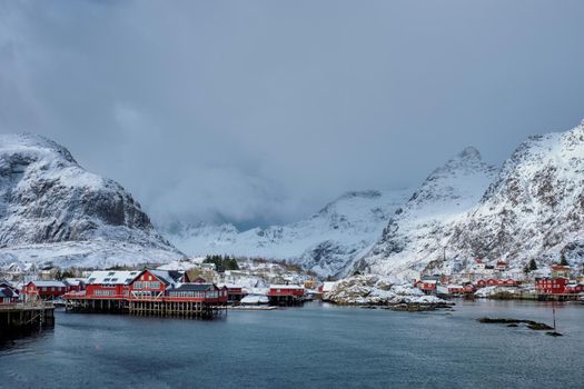 Traditional fishing village A on Lofoten Islands, Norway with red rorbu houses. With snow in winter