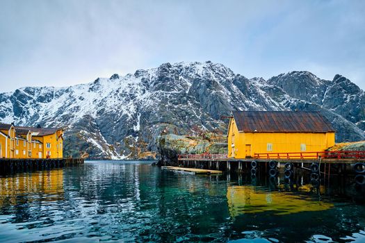 Nusfjord authentic fishing village in winter with red rorbu houses. Lofoten islands, Norway