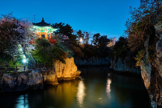 Scenic Yongyeon Pond with Yongyeon Pavilion illuminated at night, Jeju islands, South Korea