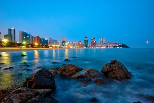 Haeundae beach in Busan at night with illuminated skyscrapers, Busan, South Korea