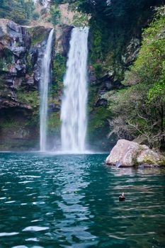 Cheonjiyeon waterfall falls one of tourist attractions of Jeju Island, South Korea