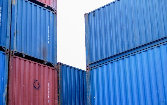 The layer of cargo container in shipping area with day light.