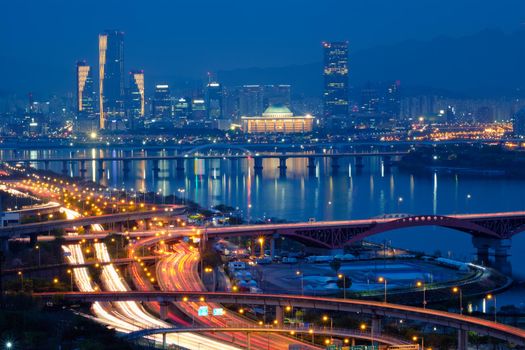 Aerial view of Seoul downtown cityscape and Seongsan bridge over Han River in twilight. Seoul, South Korea.