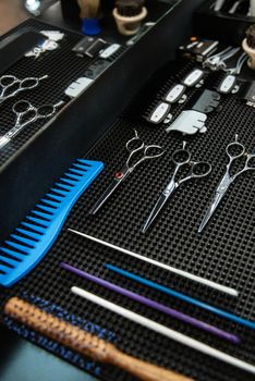 the tools of a Barber on the desktop in front of the mirror