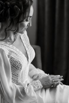 the bride gently touches her dear engagement ring