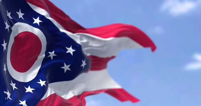 The US state flag of Ohio waving in the wind. Ohio is a state in the Midwestern region of the United States. Democracy and independence.