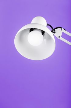 White table office lamp on pink background with space for text and idea concept