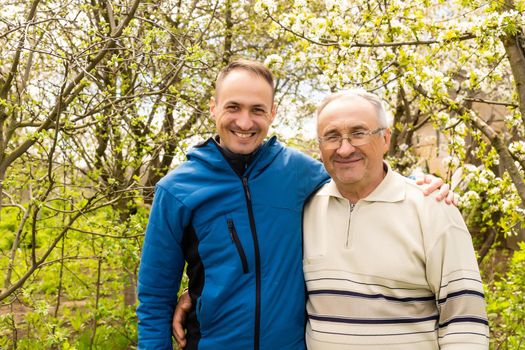 portrait of happy father and son, which are similar in appearance