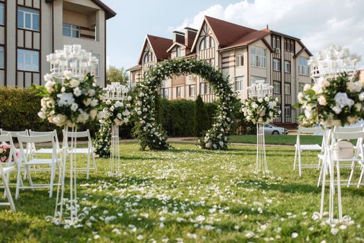 wedding ceremony area, arch chairs decor