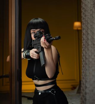 the female hitman in a hotel near the window aims an automatic rifle with a telescopic sight at the victim committing murder