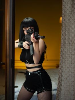 the female hitman in a hotel near the window aims an automatic rifle with a telescopic sight at the victim committing murder