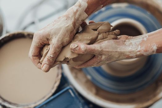 Close Up of Female Hands Holding Pile of Clay, Top Down View on Pottery Master at Work