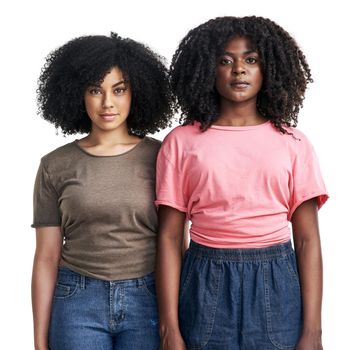 Studio portrait of two attractive young women posing against a white background.