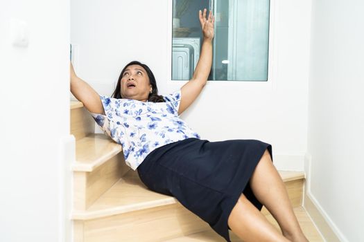 Asian middle-aged lady woman patient fall down the stairs because slippery surfaces