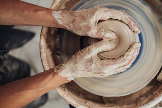 Top Down View of Potter Master at Work in Clay Studio, Handmade Process of Creating Pot on Pottery Wheel