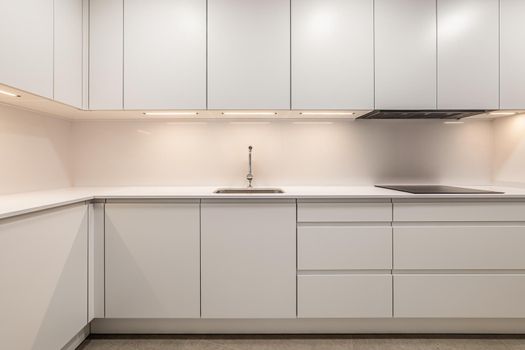 White empty classic kitchen in front view in new or refurbished apartment.