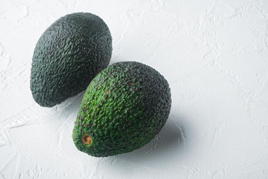 Whole pair of green avocado set, on white background with copy space for text